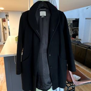 The Cocoon Coat Black 
Funnel-neck mid-length Italian wool-cashmere coat